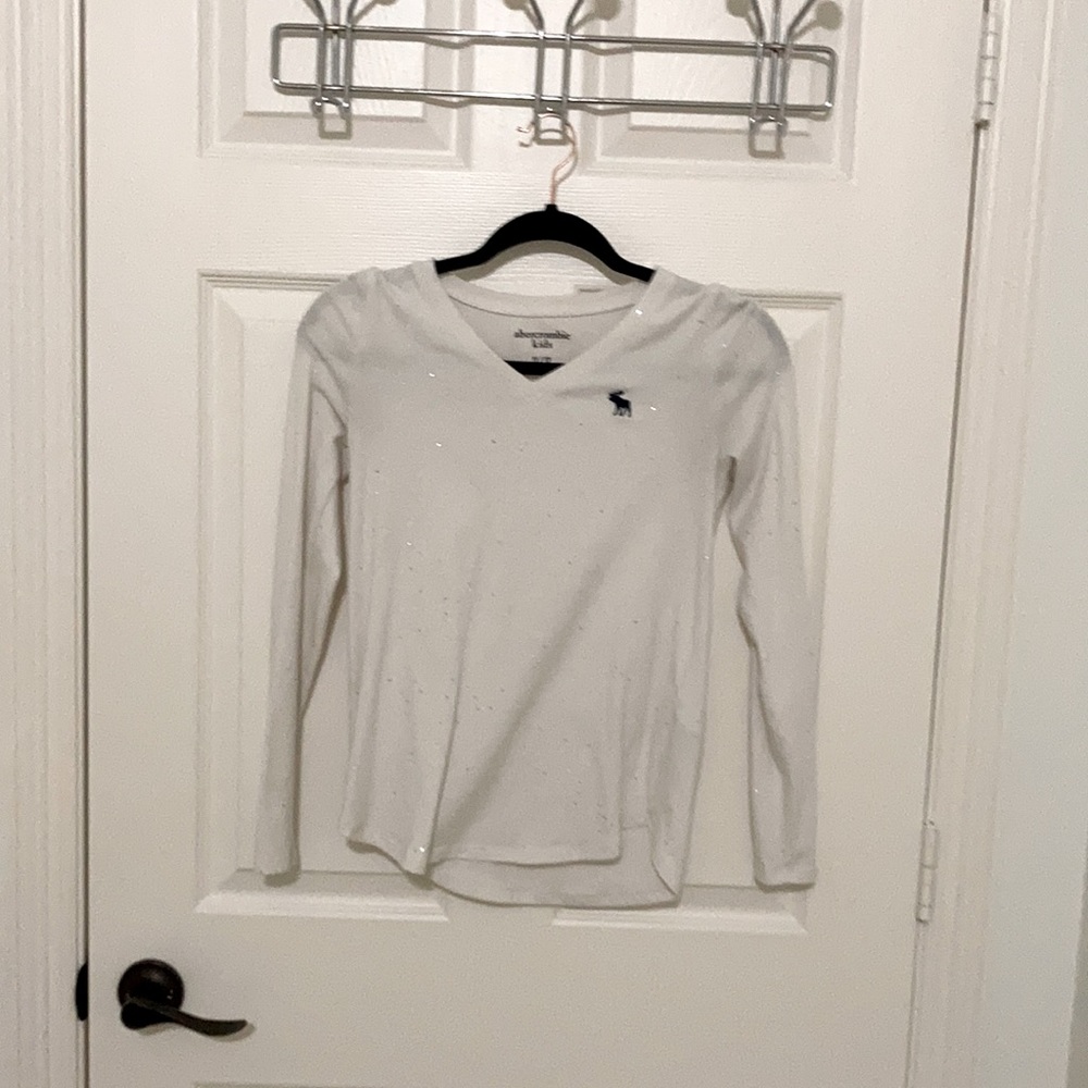 A glittery white sweater/tee.